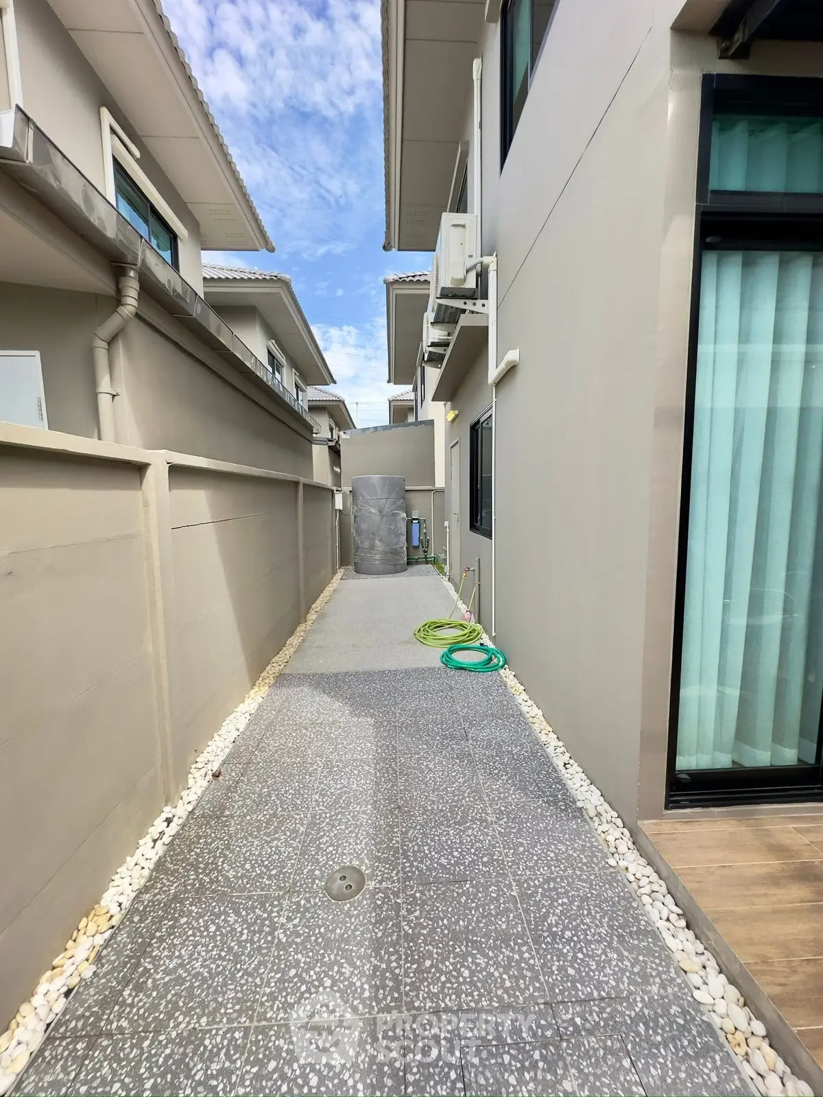 Modern exterior walkway with sleek design and clean lines in a residential property.