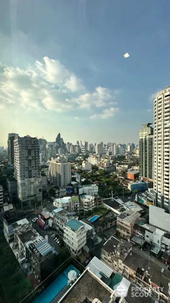 Stunning cityscape view from high-rise building showcasing urban skyline and architecture.