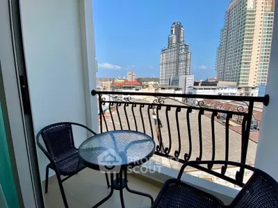 Charming balcony with city view, perfect for relaxing and enjoying the skyline.