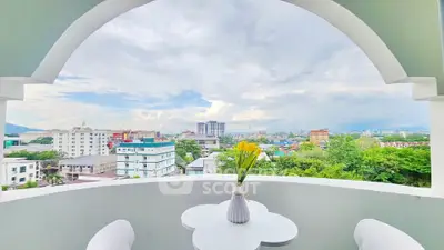 Stunning balcony view with cityscape and lush greenery, perfect for relaxation and enjoying the skyline.