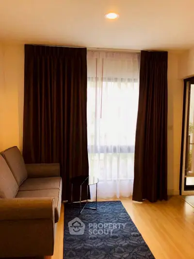 Cozy living room with elegant curtains and comfortable sofa