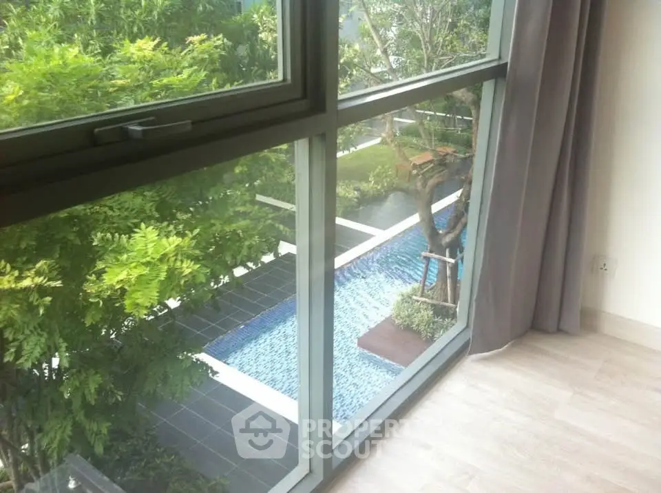 Luxurious apartment with stunning pool view from large window