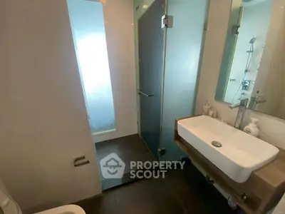 Modern bathroom with sleek design and glass shower enclosure