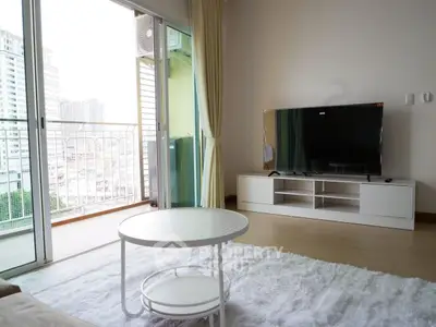 Modern living room with balcony view and sleek TV setup