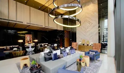 Luxurious modern living room with elegant decor and high ceilings in a premium real estate property.