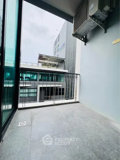 Modern balcony with sleek design and city view, perfect for urban living.