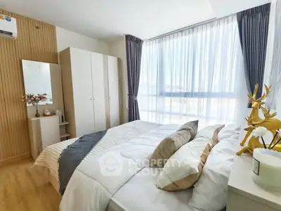 Bright and modern bedroom with large window and stylish decor