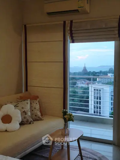 Cozy living room with a scenic view from the balcony, featuring stylish decor and comfortable seating.