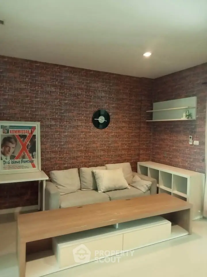Stylish living room with brick accent wall and modern furniture
