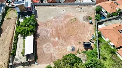 Expansive vacant land plot in residential area, ideal for development opportunities.