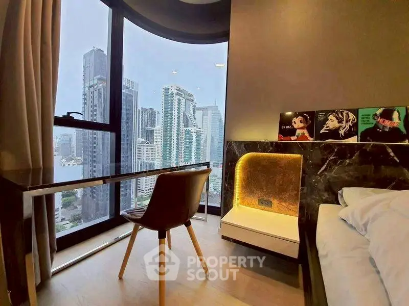 Modern bedroom with city view, sleek furniture, and stylish decor.