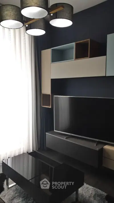 Modern living room with sleek furniture and stylish lighting, perfect for contemporary living.