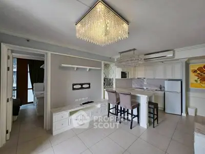 Luxurious kitchen with elegant chandelier and modern appliances