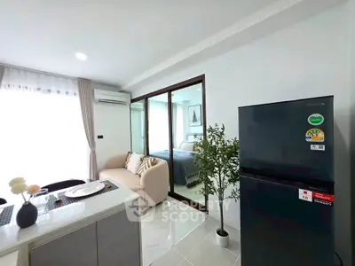 Modern apartment interior with open kitchen and cozy living area