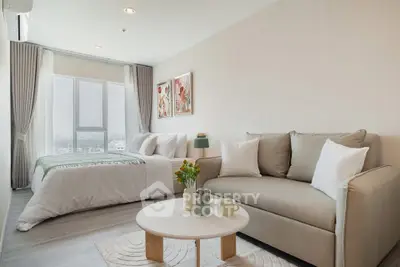 Modern studio apartment with cozy living area and stylish decor