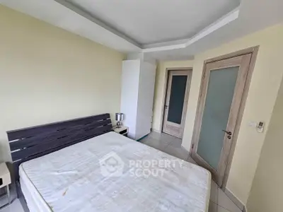 Spacious bedroom with modern design and ample natural light