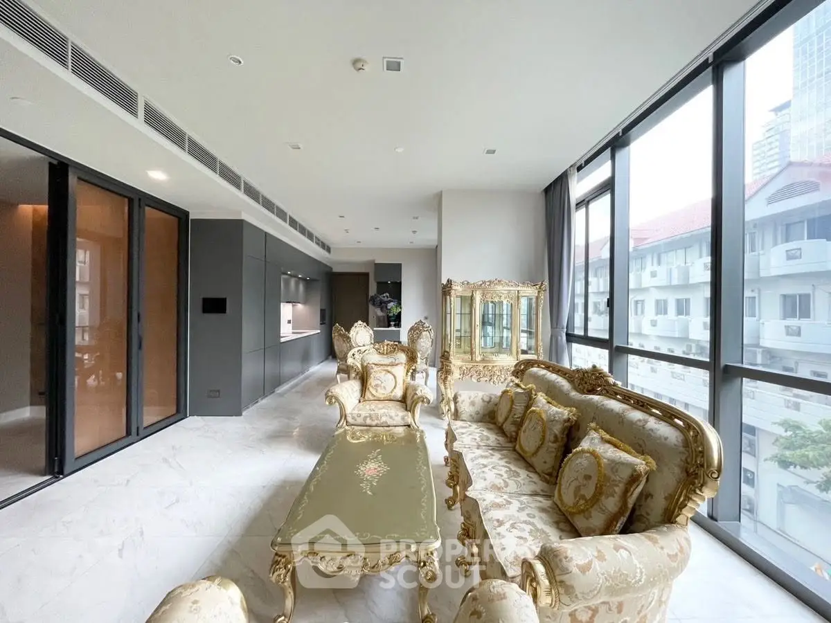 Luxurious living room with elegant furniture and large windows offering city views.