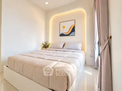 Modern bedroom with cozy lighting and stylish decor, perfect for relaxation and comfort.