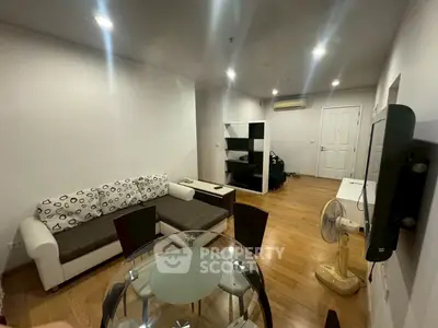 Spacious living room with modern furniture and wooden flooring