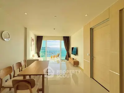 Spacious living room with ocean view and modern furnishings