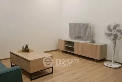Modern living room with minimalist furniture and wooden flooring