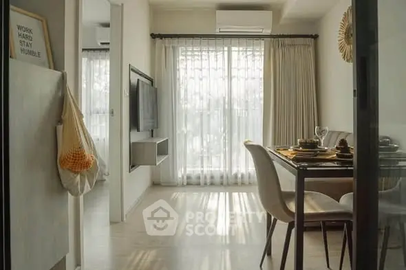 Chic dining area with natural light and modern decor in a stylish apartment.