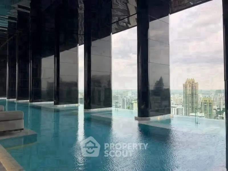 Luxurious rooftop infinity pool with stunning city skyline view