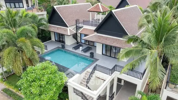 Luxurious tropical villa with private pool and lush garden, perfect for serene living.