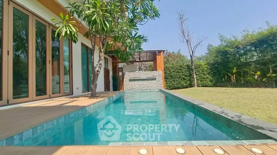 Luxurious modern home with private pool and lush garden, perfect for relaxation and entertainment.