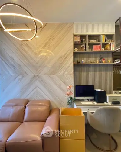 Modern living room with stylish lighting and cozy workspace