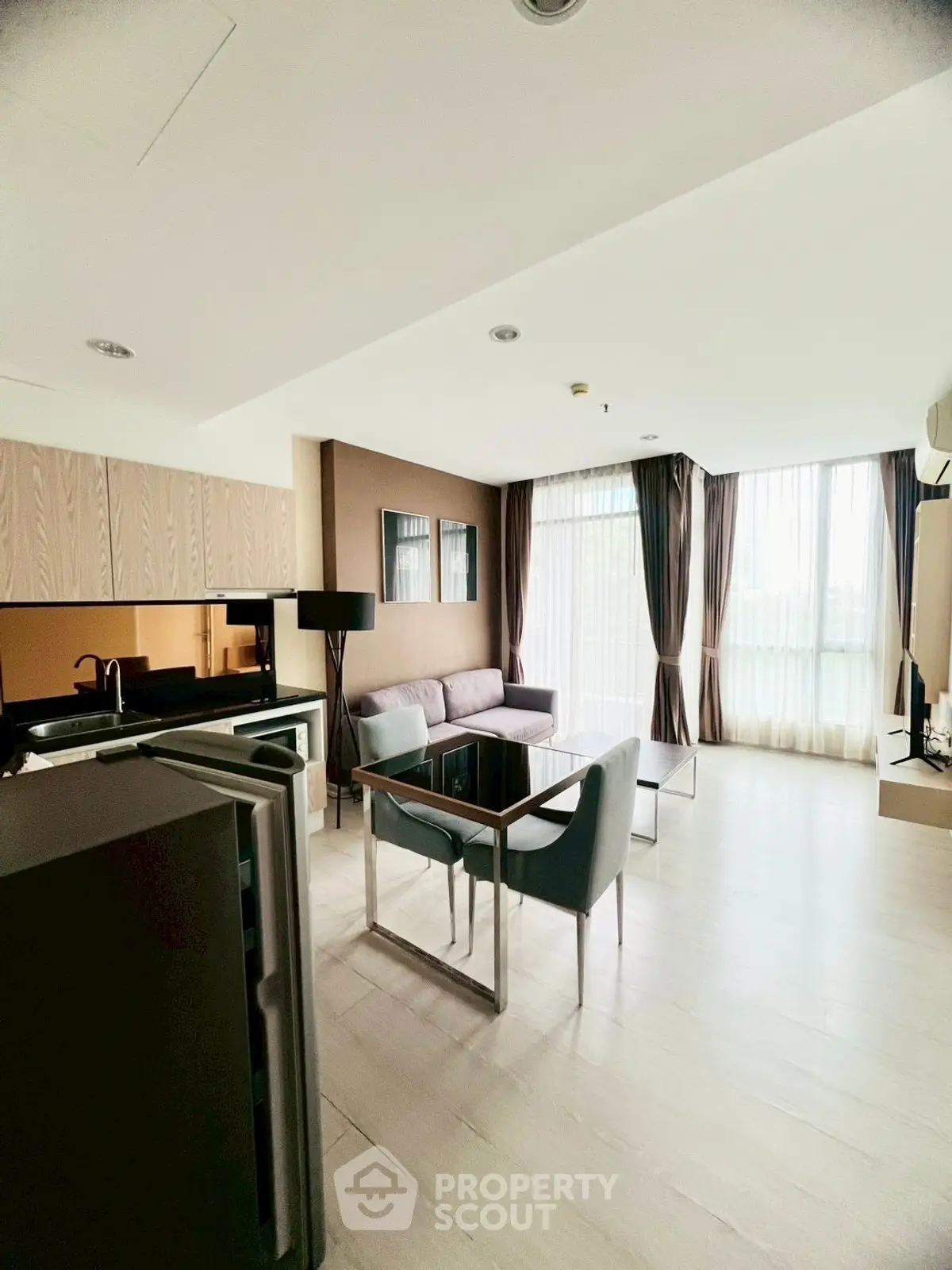 Modern living room with large windows and stylish furniture