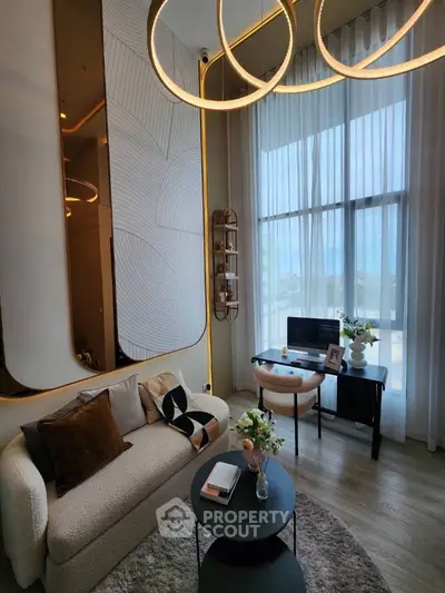 Luxurious modern living room with elegant decor and large windows