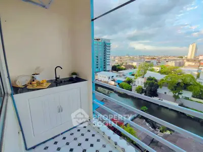 Charming balcony with city view and kitchenette, perfect for outdoor relaxation and entertaining.