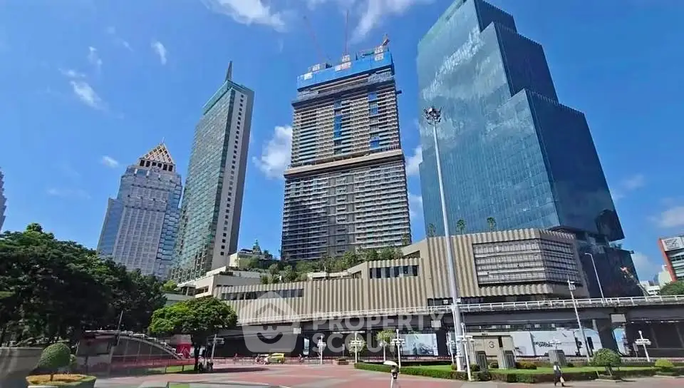 Stunning skyscrapers with modern architecture in a vibrant urban setting, showcasing prime real estate opportunities.