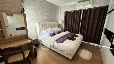 Luxurious bedroom with elegant decor and plush bedding in modern apartment