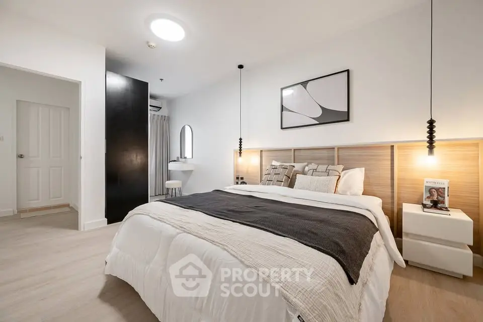 Spacious modern bedroom with stylish decor and cozy ambiance