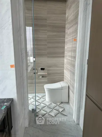 Luxurious modern bathroom with sleek design and elegant marble finishes.