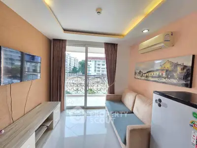 Modern living room with balcony view, featuring sleek furniture and air conditioning.