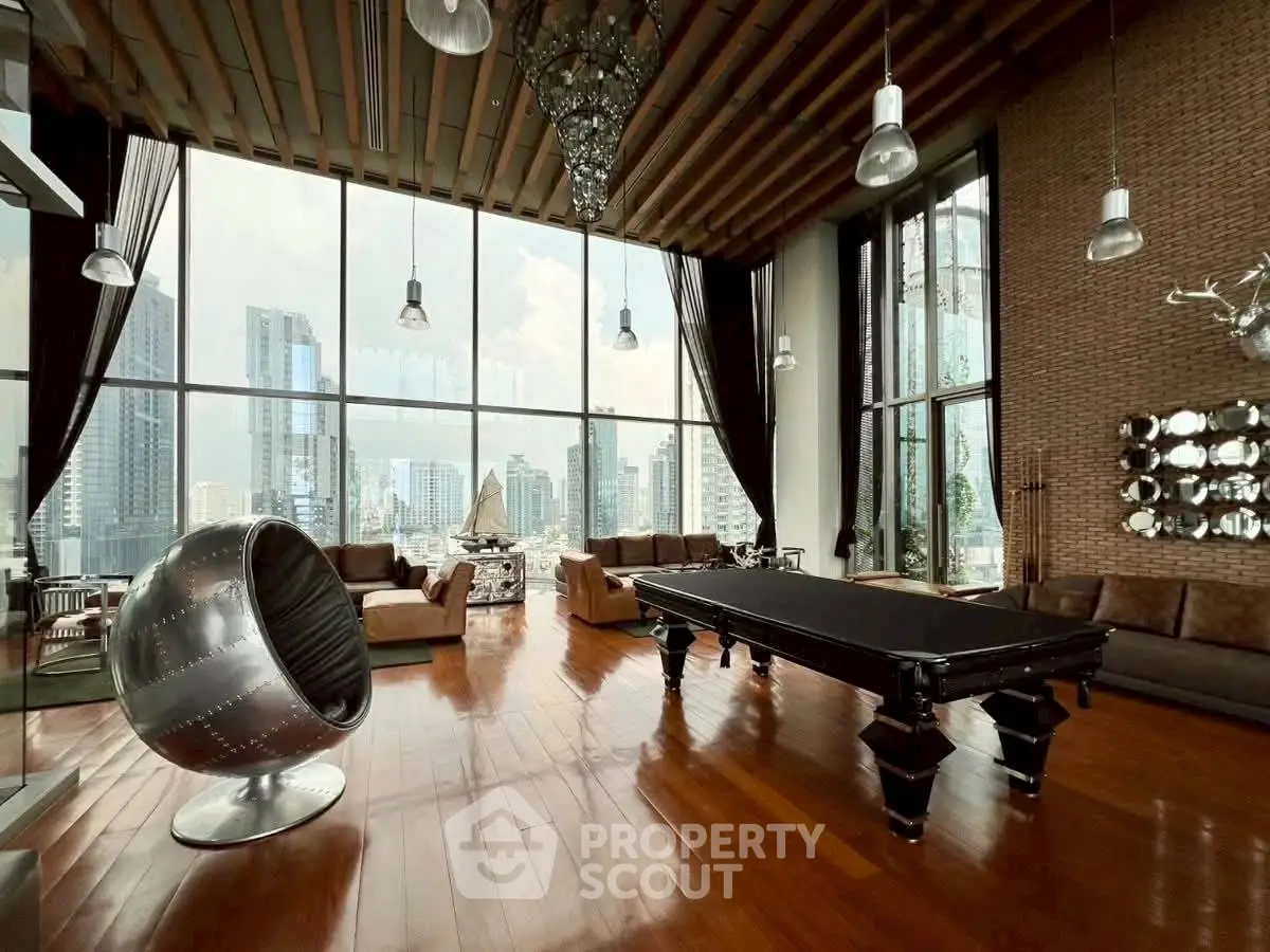 Luxurious living room with floor-to-ceiling windows and stunning city view
