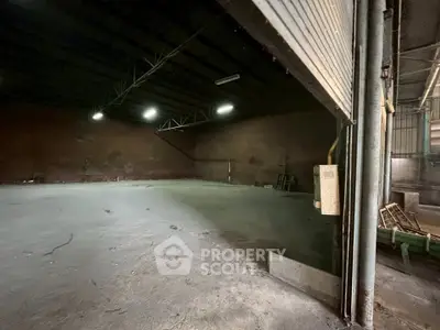 Spacious industrial warehouse with high ceilings and ample storage space.