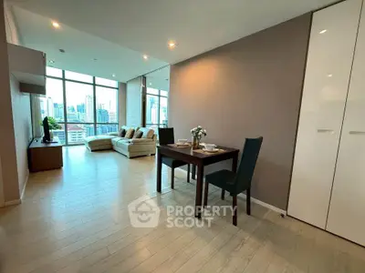 Spacious modern living room with city view and elegant dining area