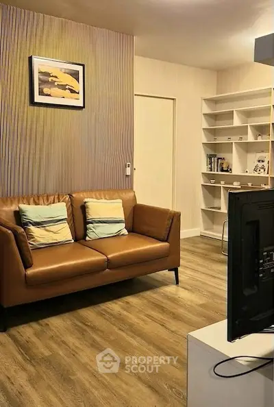 Modern living room with stylish decor and cozy seating area, perfect for relaxation and entertainment.