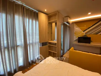 Modern bedroom with stylish decor and ample natural light