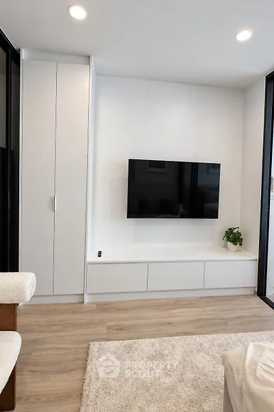 Modern living room with sleek TV setup and minimalist decor