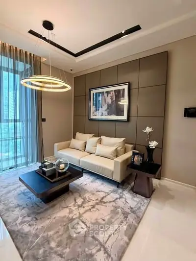 Luxurious modern living room with elegant decor and large window view.