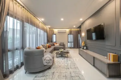 Luxurious modern living room with elegant decor and large windows