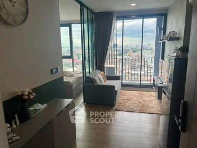 Modern living room with city view and cozy decor in high-rise apartment