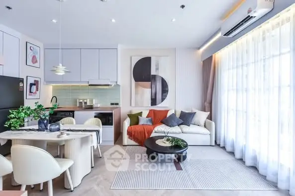 Modern open-plan living room with stylish decor and natural light