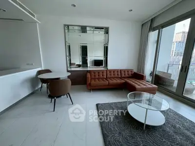 Modern living room with stylish furniture and city view balcony