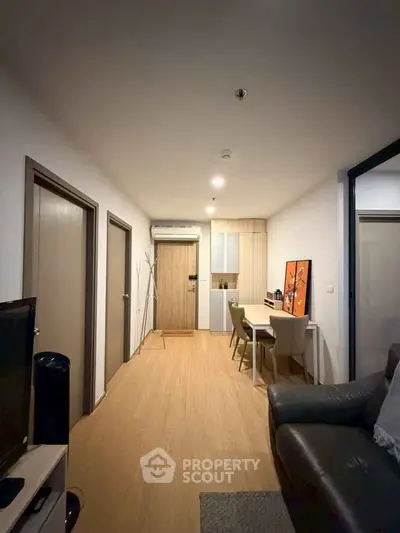 Modern apartment interior with cozy living area and stylish dining space